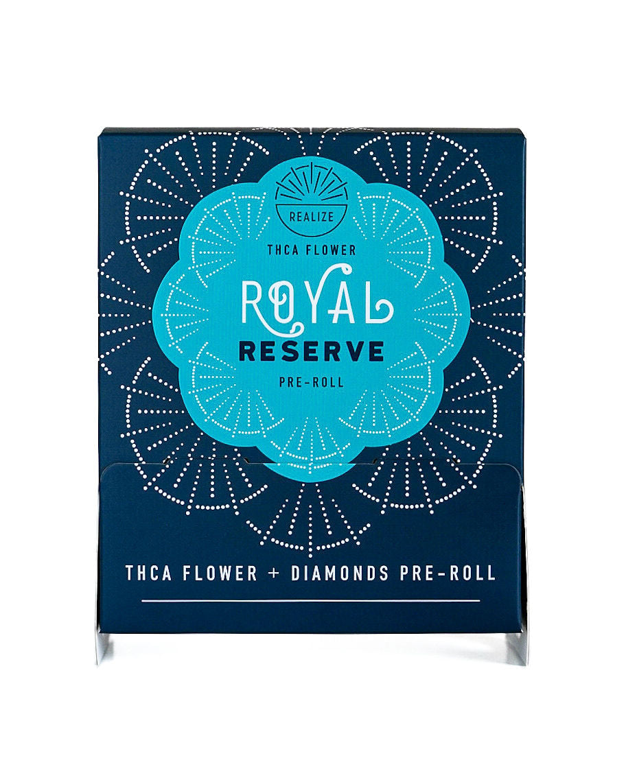 REALIZE Royal Reserve wholesale THCA flower + diamonds pre-roll packaging, featuring a teal mandala-style design on a navy display box